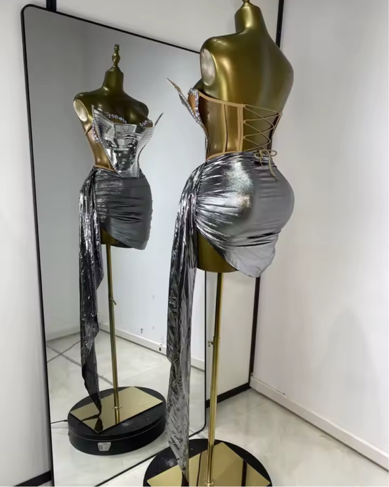 futuristic silver dress The beige crystallized dress blends futuristic cuts with intricate  beadwork, symbolizing time and the future. Its avant-garde design showcases  clean lines, innovative shapes, and shimmering beige crystals, reflecting a  timeless essence. C H R O N O S