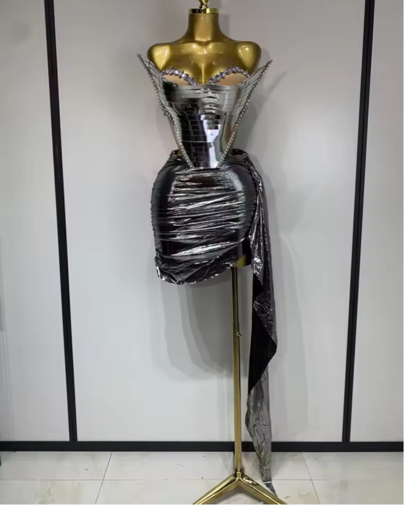 futuristic silver dress The beige crystallized dress blends futuristic cuts with intricate  beadwork, symbolizing time and the future. Its avant-garde design showcases  clean lines, innovative shapes, and shimmering beige crystals, reflecting a  timeless essence. C H R O N O S